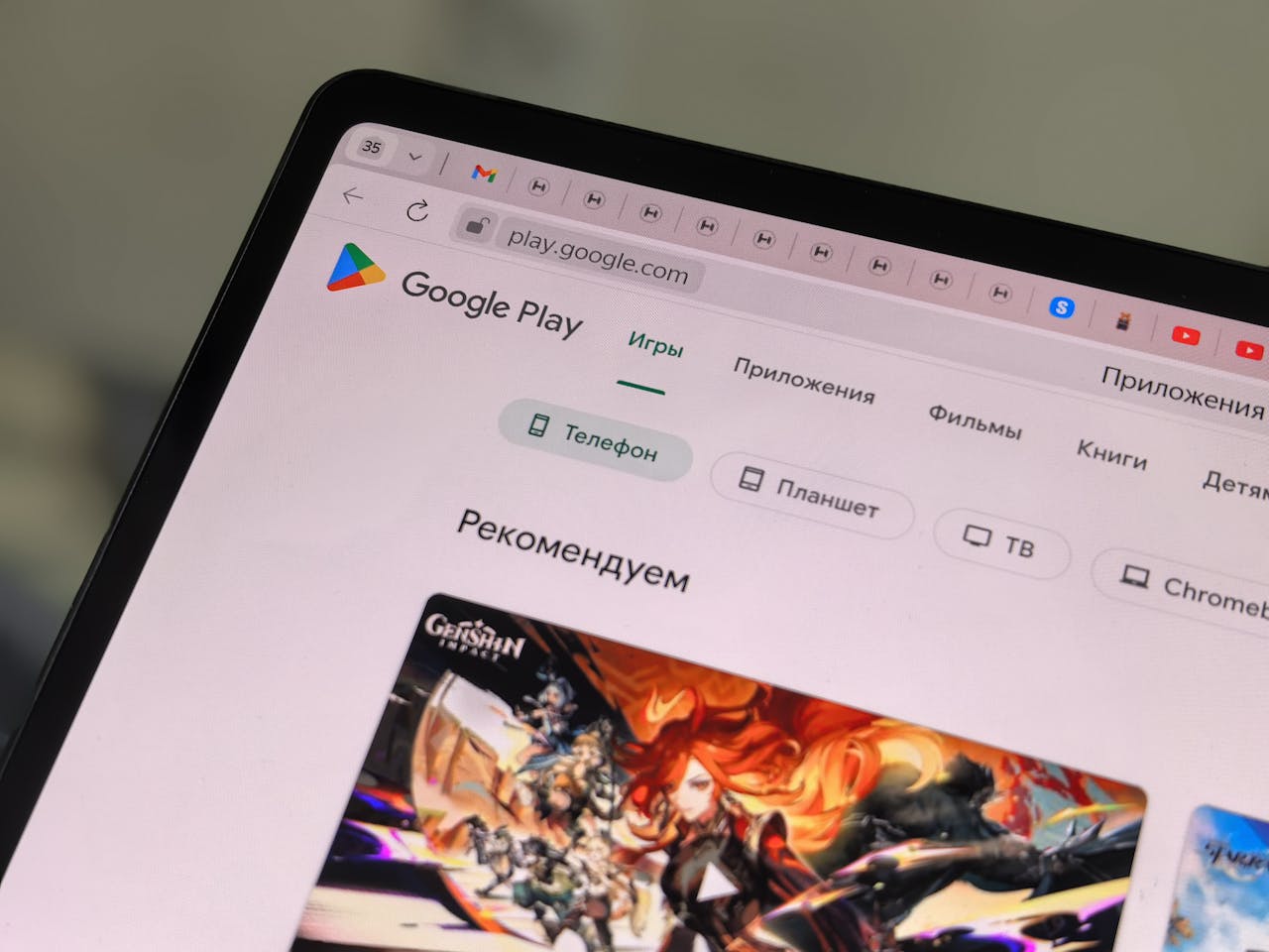 Services Close-up of a tablet displaying the Google Play Store interface in Russian.